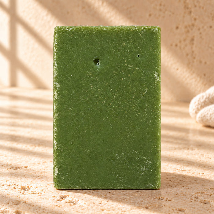 Citrus Grove soap — AI-styled limestone setting using the product photograph.
