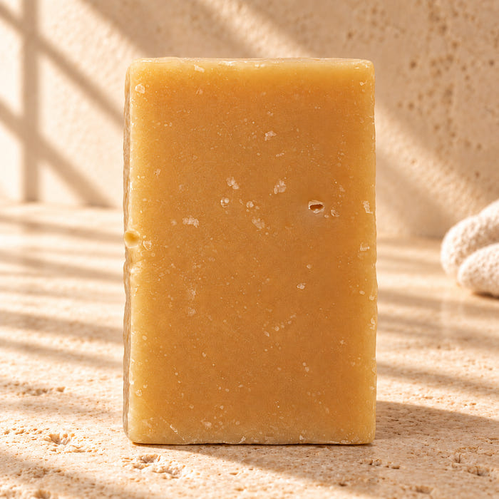 Lemcolada soap — AI-styled limestone setting using the product photograph.
