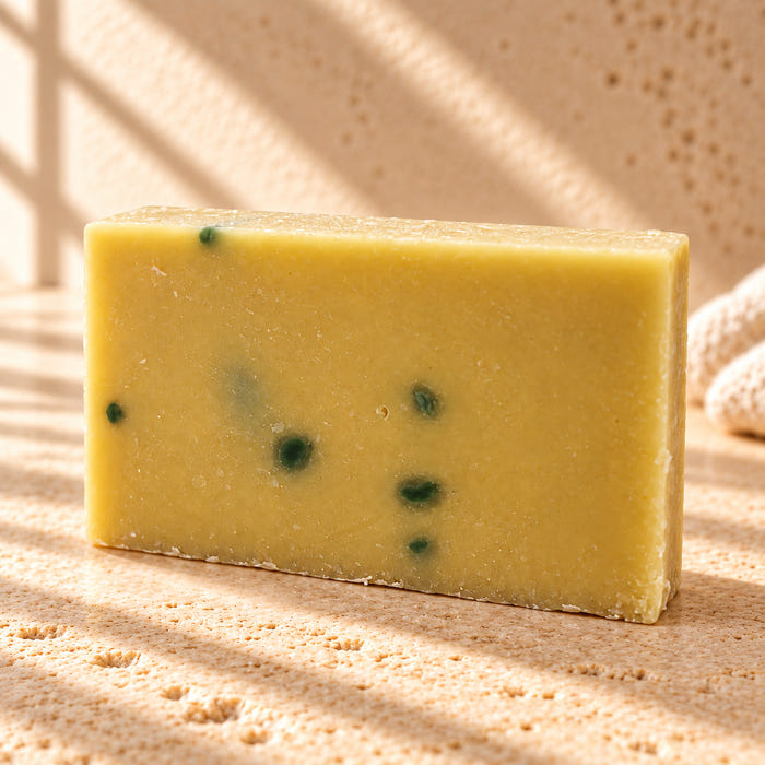 The Bright One soap — AI-styled limestone setting using the product photograph.