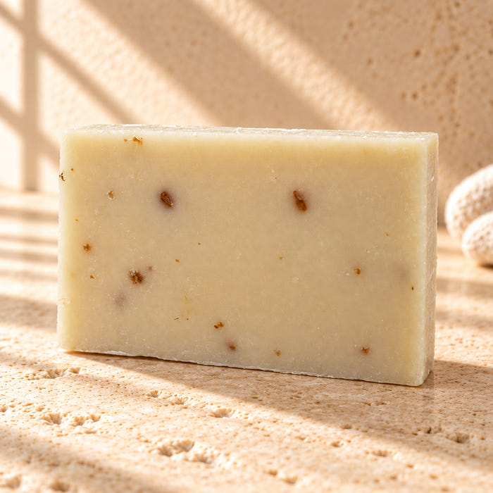 The Closer soap — AI-styled limestone setting using the product photograph.