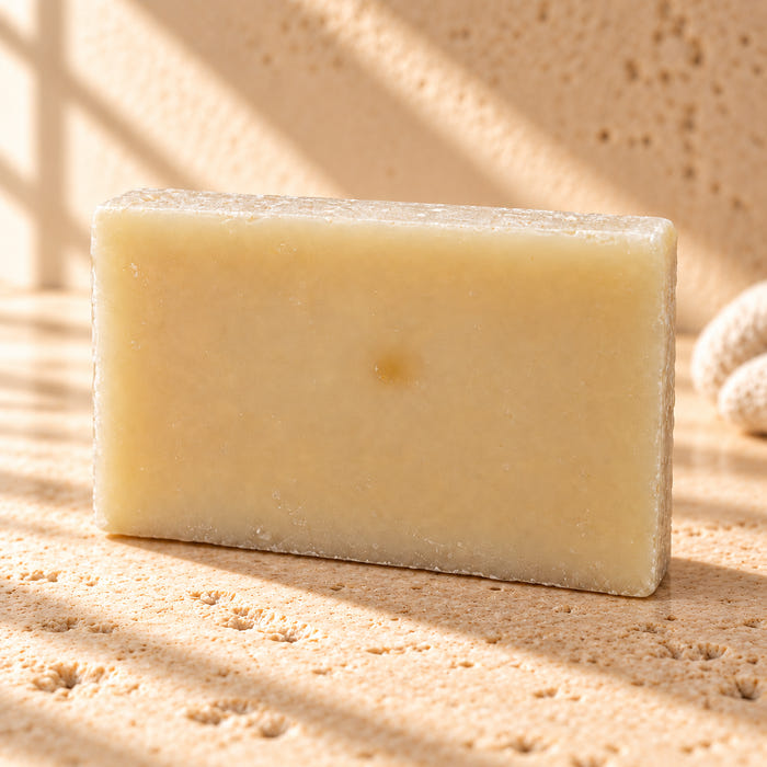The Regular soap — AI-styled limestone setting using the product photograph.